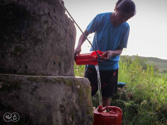 A prayer for water around a well in East Sumba