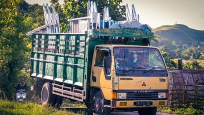 A truck loaded with toilet basins and construction materials