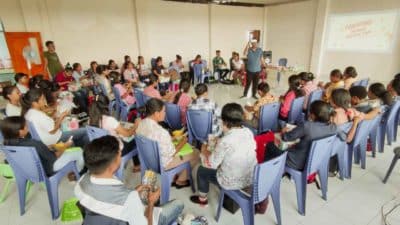 Participants attending a primary medical care training session in a classroom