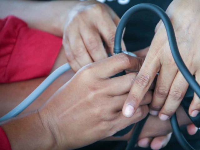 Training in taking blood pressure as part of the primary medical care program in rural areas.