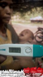 A health agent from Kawan Sehat is providing medical care to a patient in a remote village.