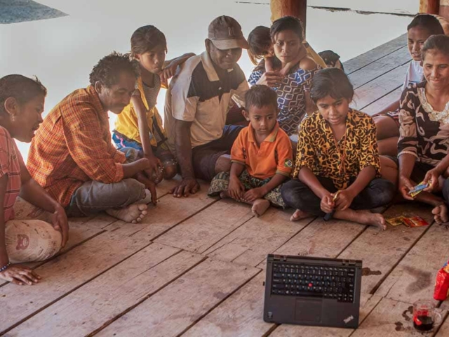 Photos of Fair Future Foundation staff and local community members working together on construction and educational projects, symbolizing collaboration and shared learning.