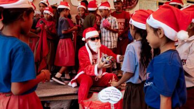 Children and families in an East Sumba village celebrate Christmas with gifts, shared meals, and joyful moments organized by Fair Future.