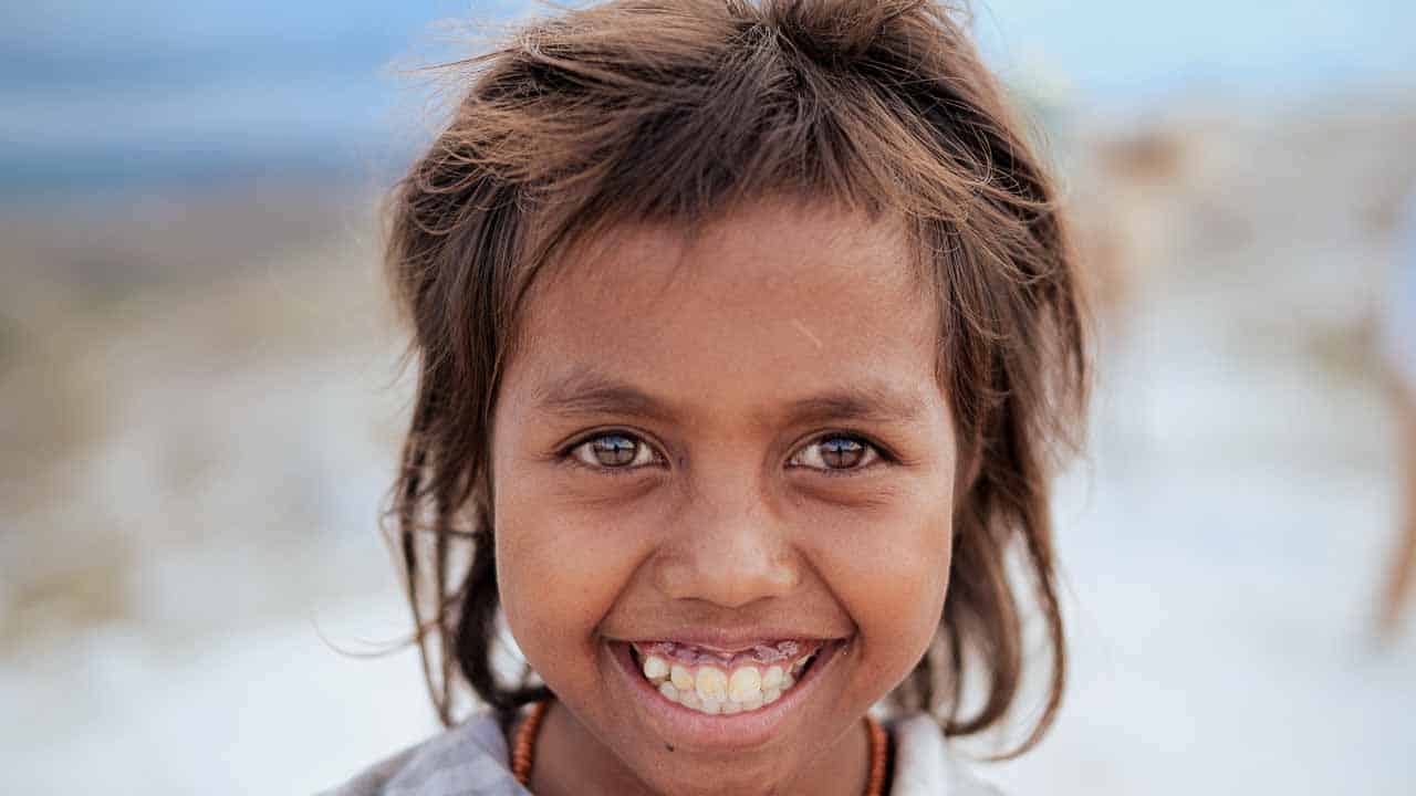 People in ultra-rural communities laughing together, demonstrating the health benefits of smiling and social connection.