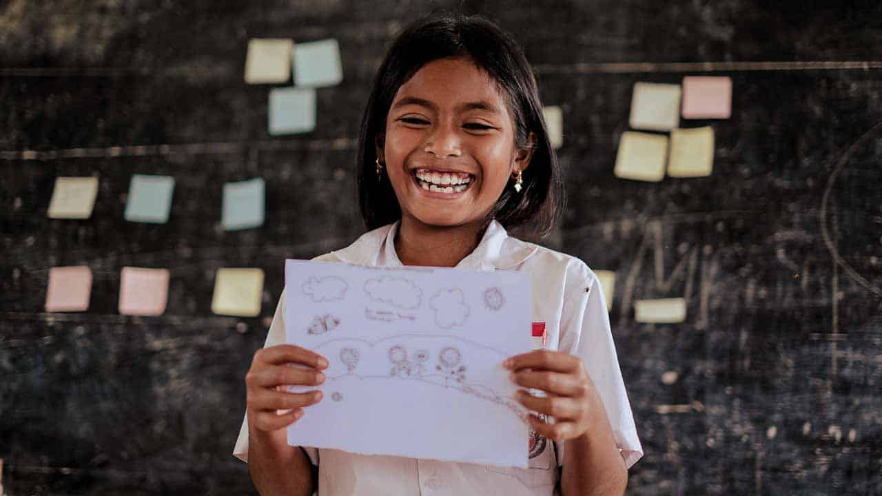 People in ultra-rural communities laughing together, demonstrating the health benefits of smiling and social connection.