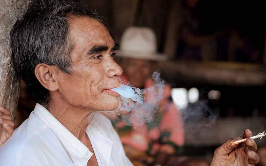 A mother and child exposed to secondhand smoke in a rural village emphasizing the dangers of passive smoke