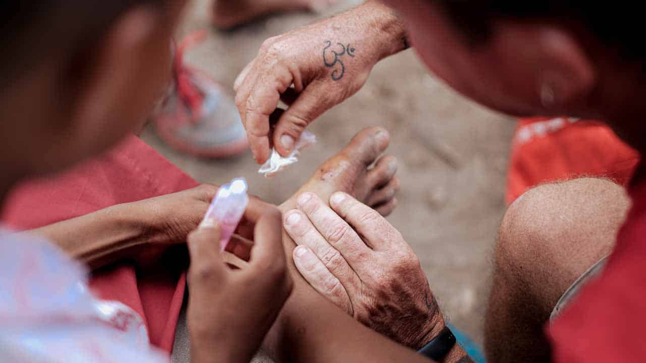 Children receiving clean water and medical care funded by small donations to Fair Future Foundation.