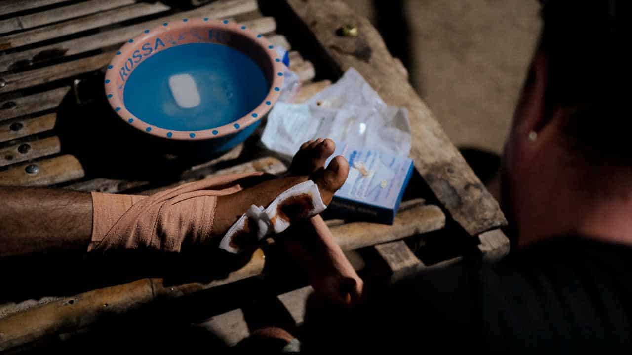 Children receiving clean water and medical care funded by small donations to Fair Future Foundation.