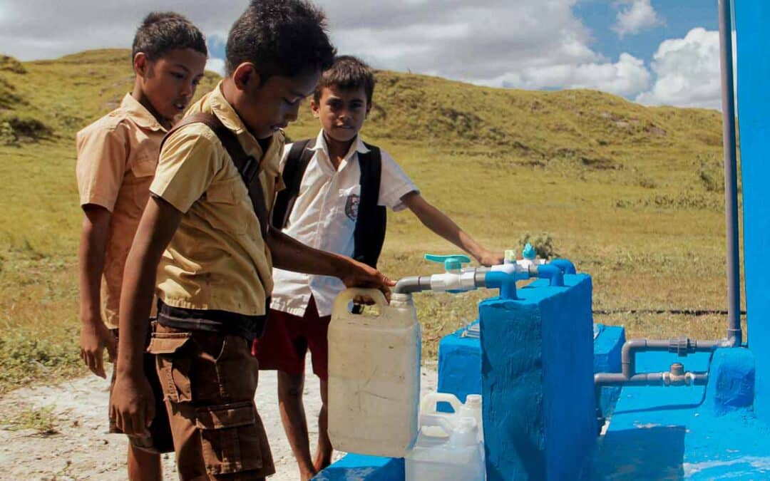 Remote villagers in Laindatang collecting water from distant sources due to a lack of local reservoirs.