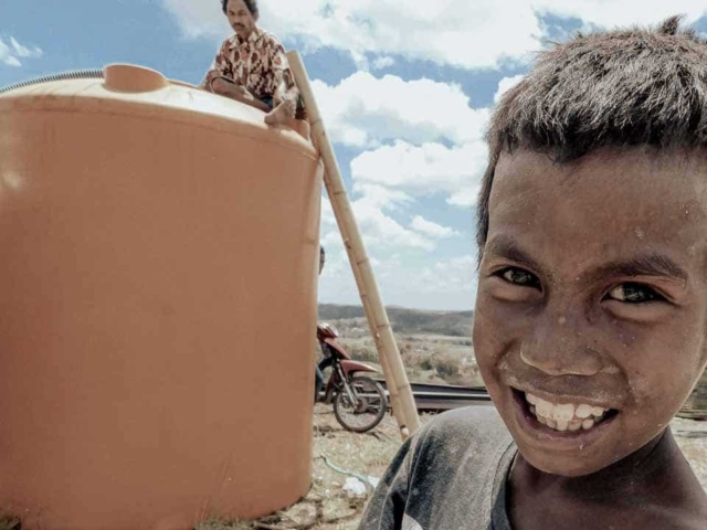 A dry riverbed in an Indonesian village, symbolizing the worsening water crisis due to extreme heat.