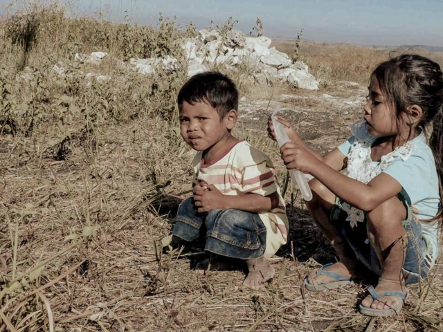 A dry riverbed in an Indonesian village, symbolizing the worsening water crisis due to extreme heat.