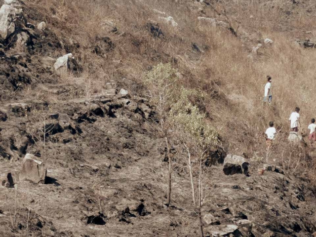 A dry riverbed in an Indonesian village, symbolizing the worsening water crisis due to extreme heat.