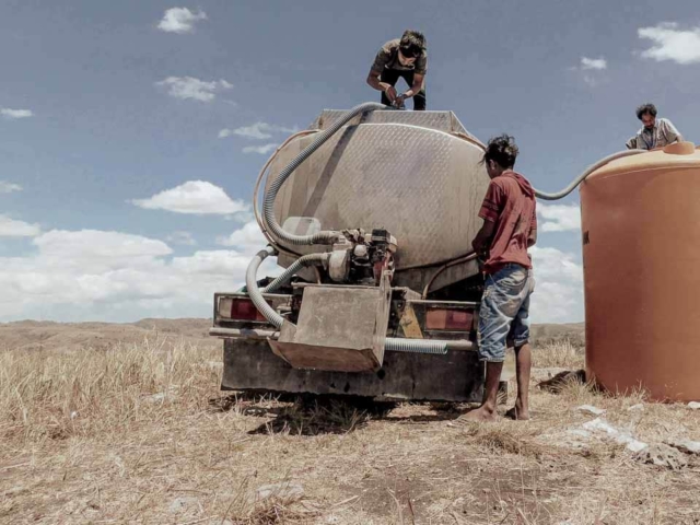 A dry riverbed in an Indonesian village, symbolizing the worsening water crisis due to extreme heat.