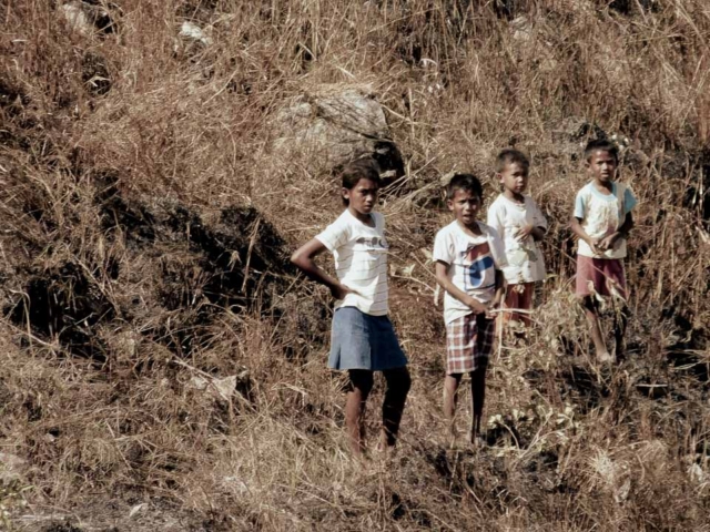 A dry riverbed in an Indonesian village, symbolizing the worsening water crisis due to extreme heat.