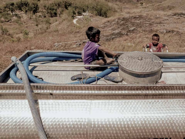 A dry riverbed in an Indonesian village, symbolizing the worsening water crisis due to extreme heat.