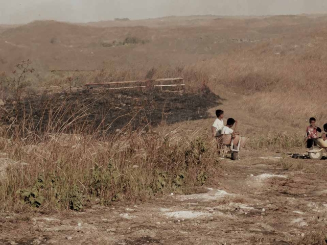 A dry riverbed in an Indonesian village, symbolizing the worsening water crisis due to extreme heat.