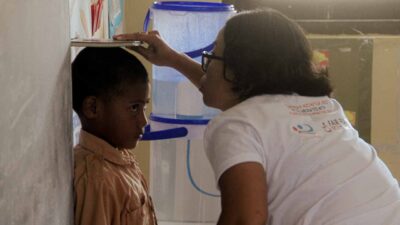 Fair Future team unloading medical supplies and water tanks for isolated villages in Sumba.