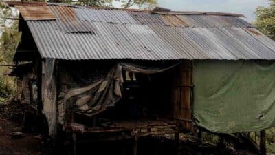 A poorly constructed house in Umalulu, East Sumba, showing vulnerable living conditions contributing to malaria risk