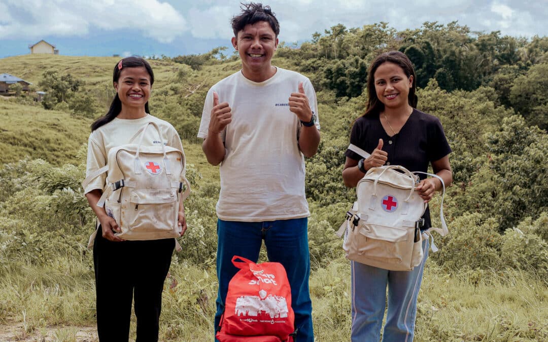Erwin delivering medical supplies to Kawan Sehat health agents