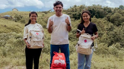 Erwin delivering medical supplies to Kawan Sehat health agents