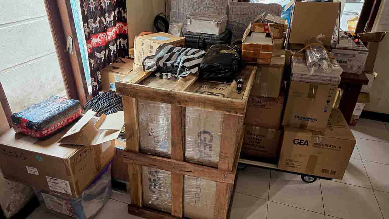 Crates and boxes of medical equipment prepared for delivery to RSUD Waingapu