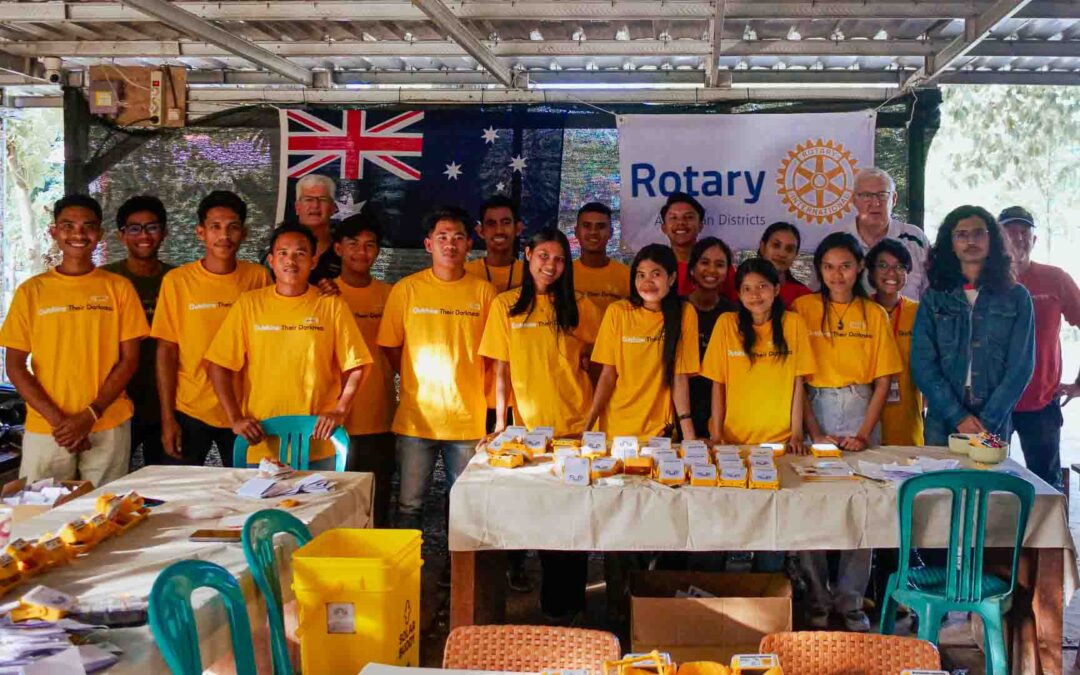 Volunteers and Rotary testing SolarBuddy lamps at Rumah Kambera in East Sumba