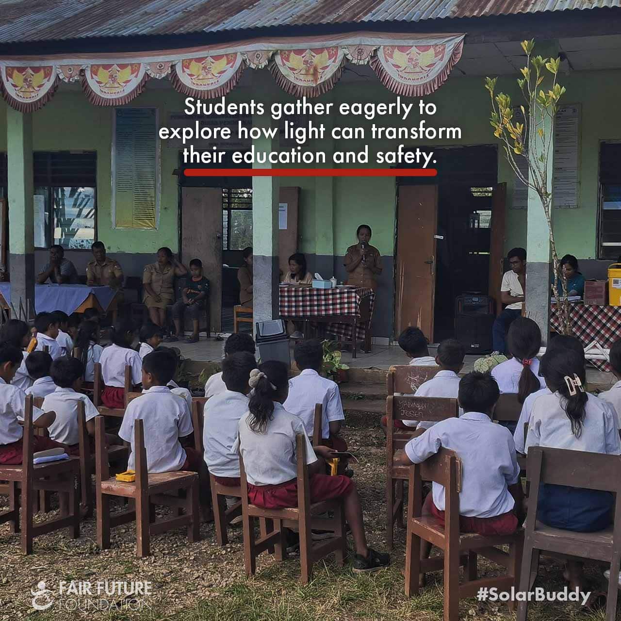 Child assembling SolarBuddy clean light in Matawai Kurang classroom