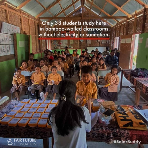 SolarBuddy lamps Lapinu children portrait Girl in Lapinu holding a SolarBuddy lamp that replaces smoke and gives clean study light in a remote East Sumba village.