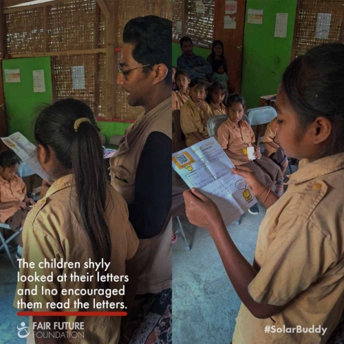 SolarBuddy lamps Lapinu children portrait Girl in Lapinu holding a SolarBuddy lamp that replaces smoke and gives clean study light in a remote East Sumba village.