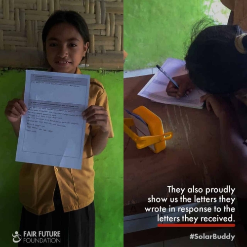 SolarBuddy lamps Lapinu children portrait Girl in Lapinu holding a SolarBuddy lamp that replaces smoke and gives clean study light in a remote East Sumba village.