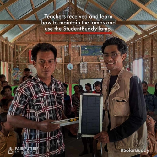 SolarBuddy lamps Lapinu children portrait Girl in Lapinu holding a SolarBuddy lamp that replaces smoke and gives clean study light in a remote East Sumba village.