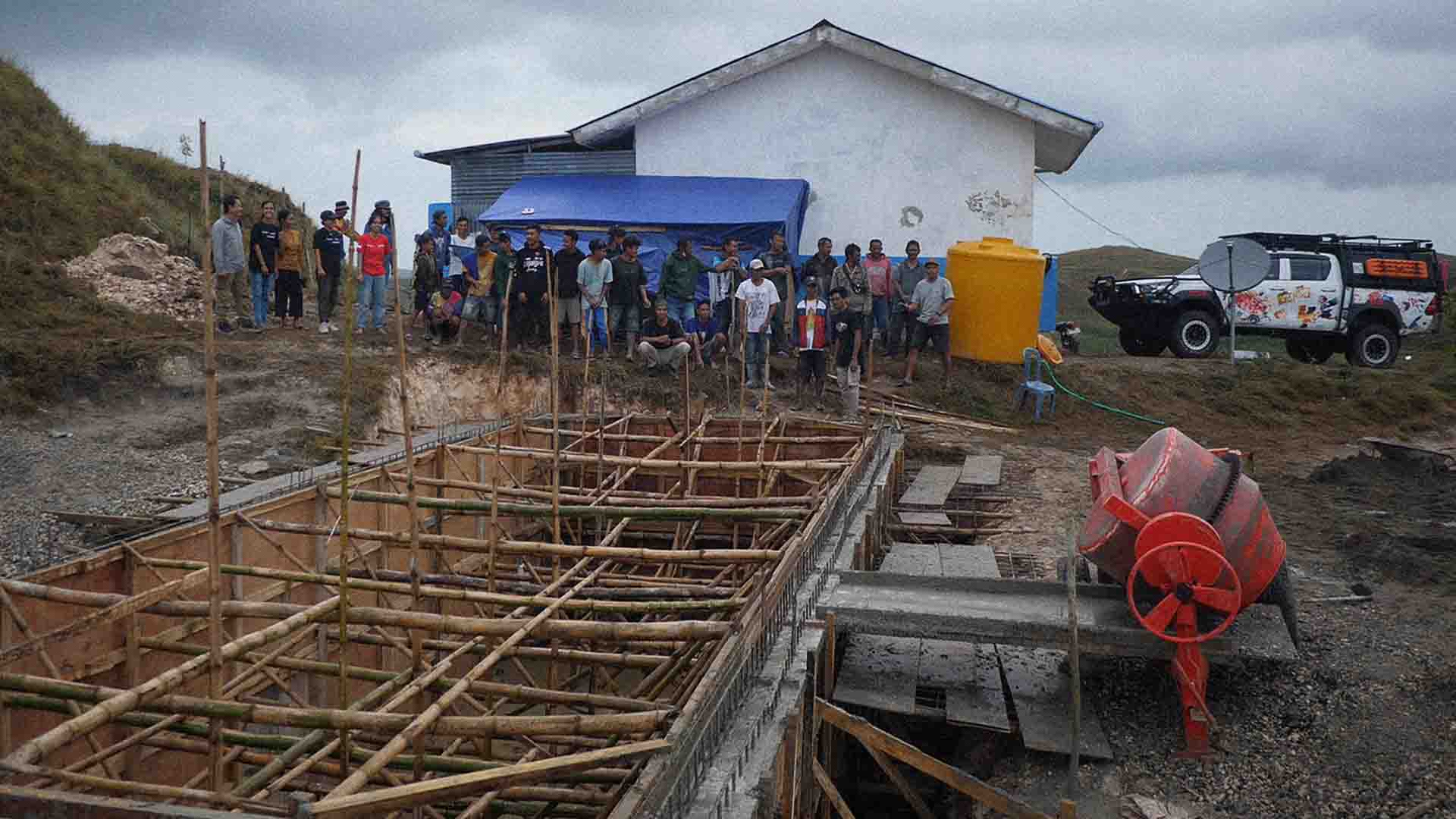 Building the Laindatang water reservoir by hand to secure future clean water access.
