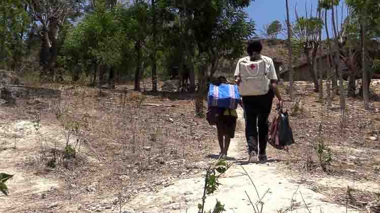 Children learning about responsibility, empathy, and environmental sustainability in a community setting.