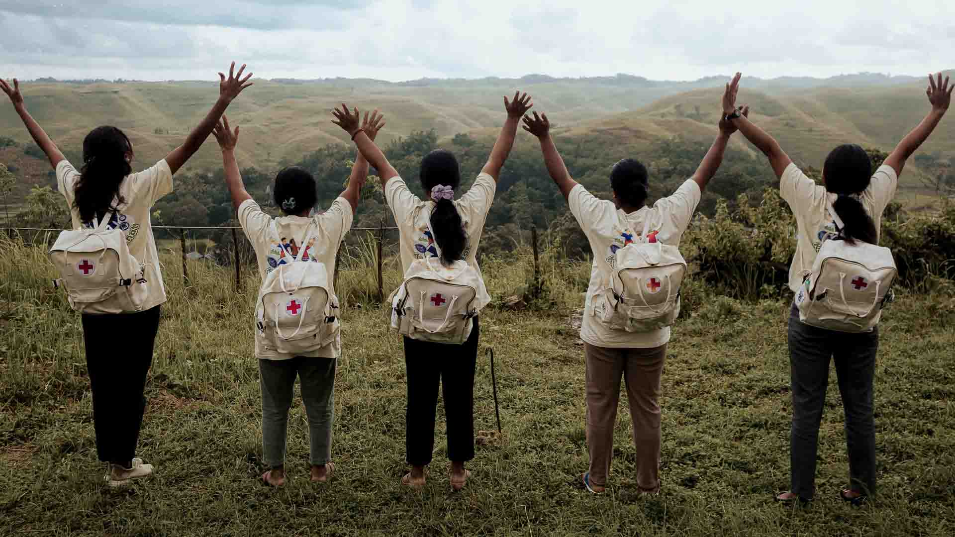 Local health agents trained under Swiss humanitarian expertise standing together after field medical work in remote areas