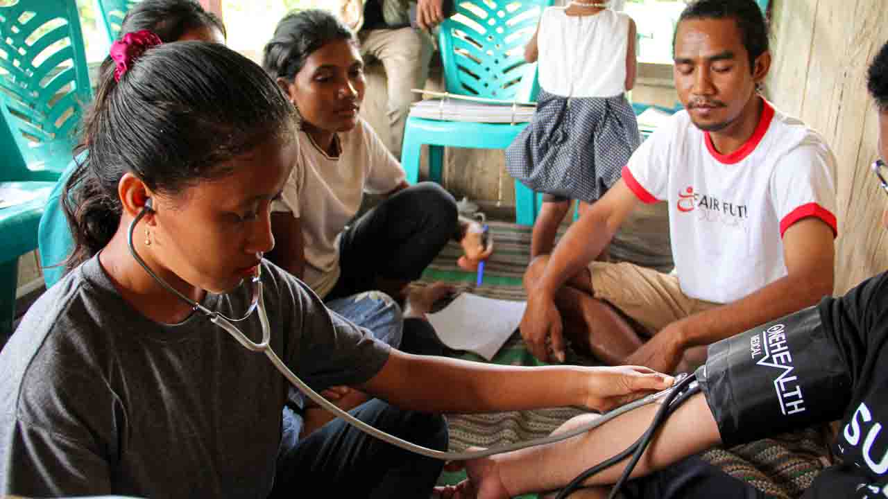 Field-based humanitarian action and working principles Field-based humanitarian action illustrating working principles through medical care, water access, education, and community engagement