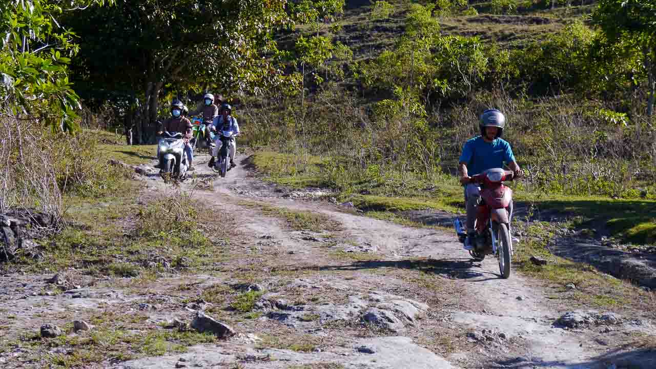 Infrastructure Determines Rural Health Outcomes Rural health infrastructure in East Sumba showing road access, medical transport and vaccine delivery