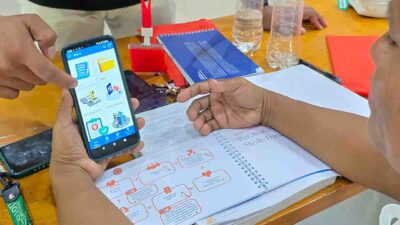 Generating Health Data Where No Data Exists • The Fair Future Foundation Health agent entering patient data on tablet during rural consultation in East Sumba