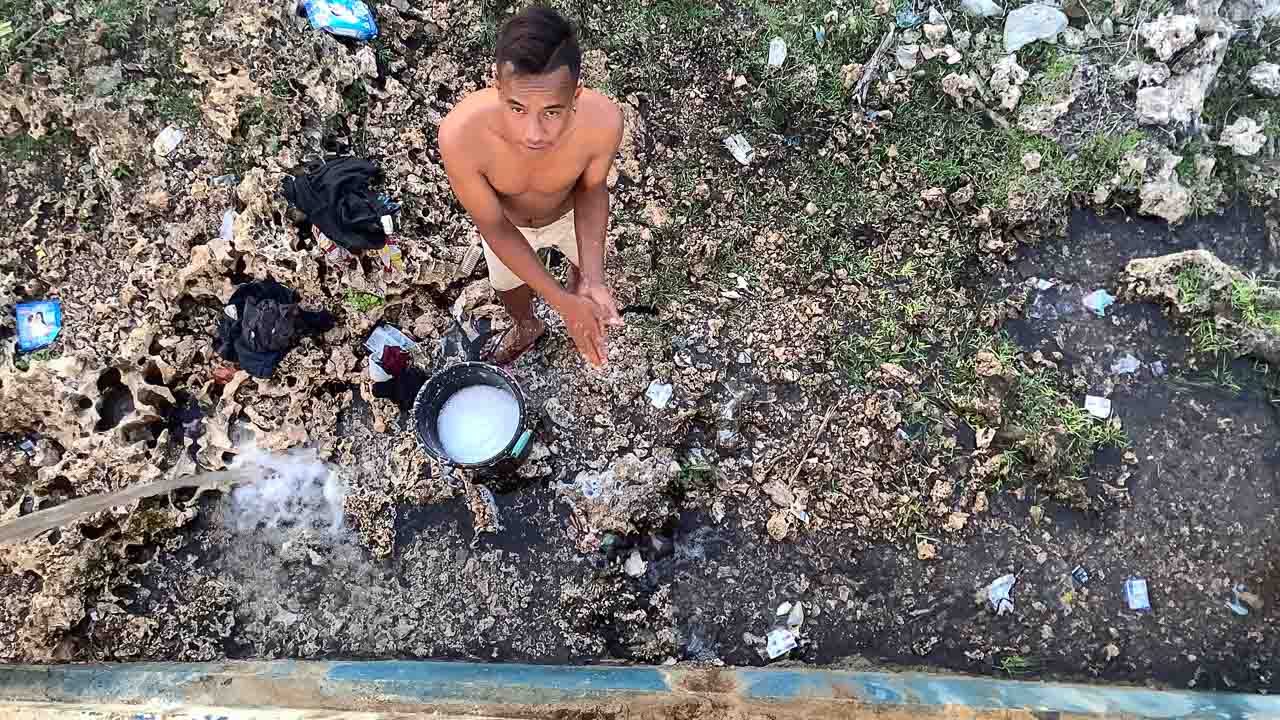 Leptospirosis Exposure in Rural East Indonesia Gallery of rural East Indonesia showing unsafe water, mud, barefoot exposure, and environmental leptospirosis risk