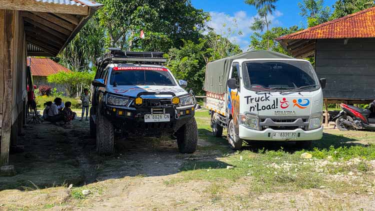 Truck of Life and Truck n’Load parked in Kampung Madutolung after six hours of extreme off-road travel in remote East Sumba, Indonesia.