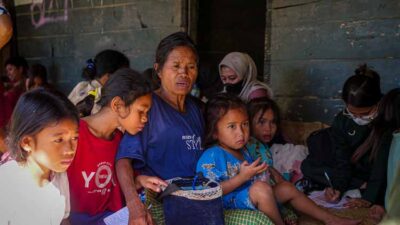 A family attends a community medical care day in East Sumba.