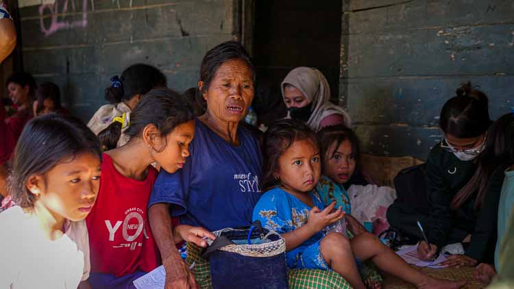 Families and children gathered during a community medical care day in rural East Sumba