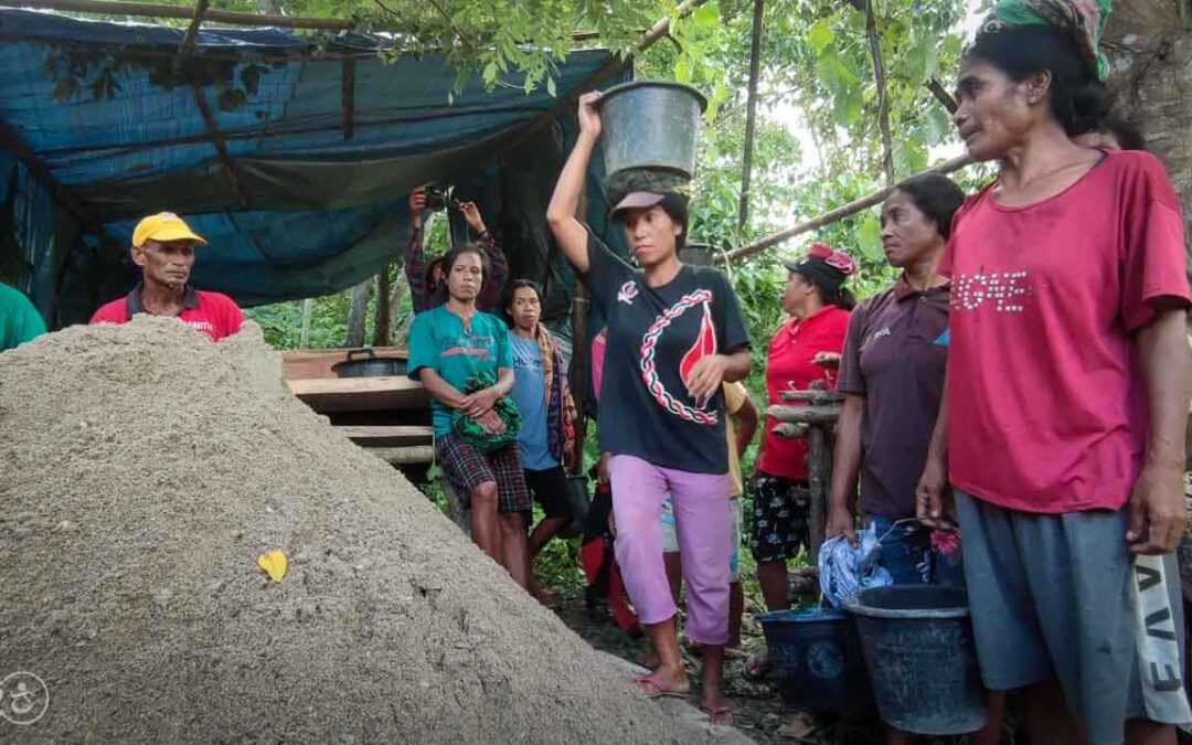 Strong women carry sand for the construction of a new clean water tank