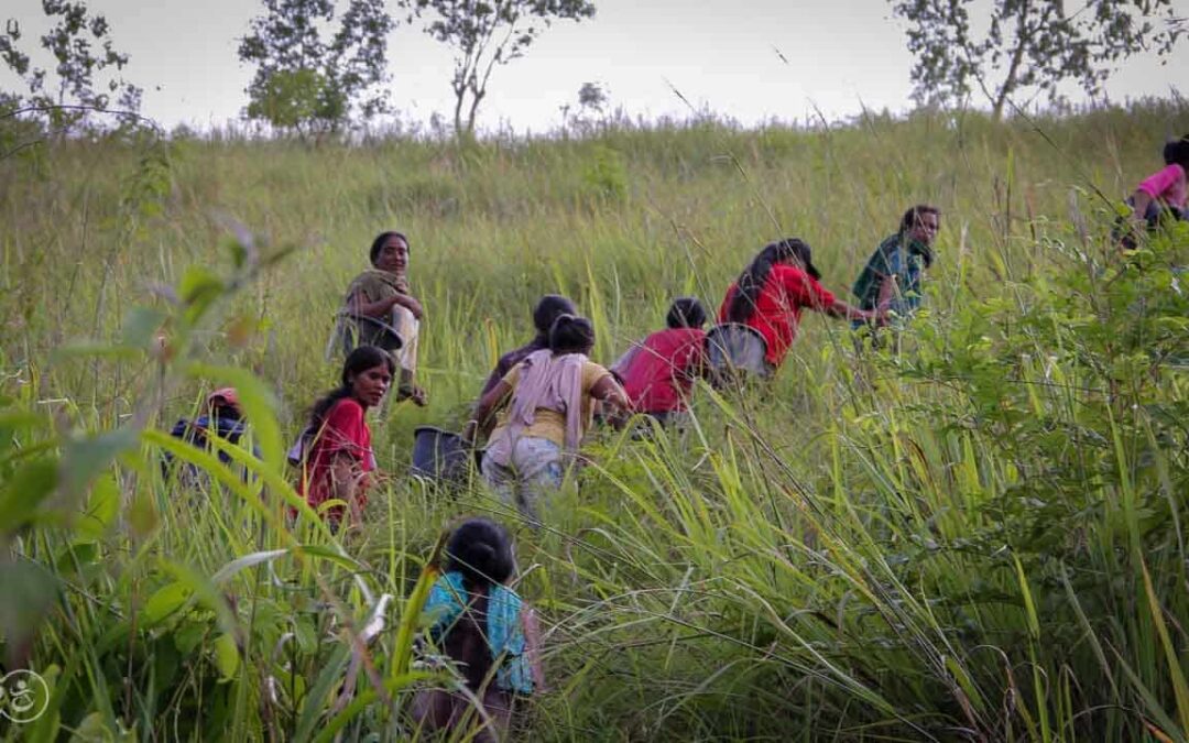 Strong women carry sand for the construction of a new clean water tank