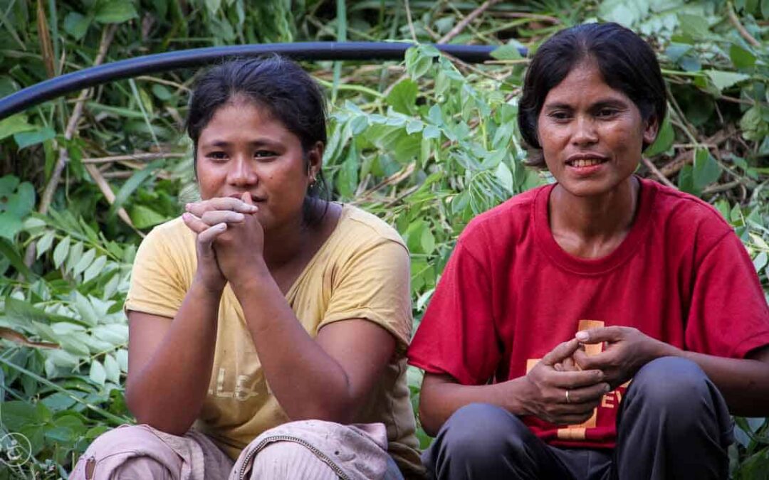 Strong women carry sand for the construction of a new clean water tank