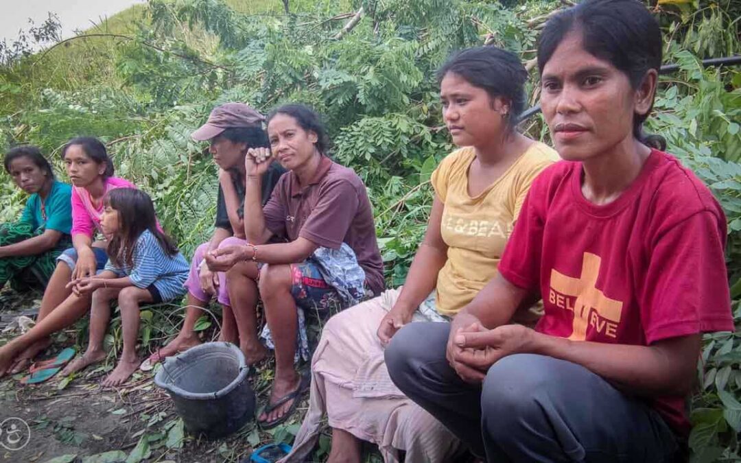 Strong women carry sand for the construction of a new clean water tank